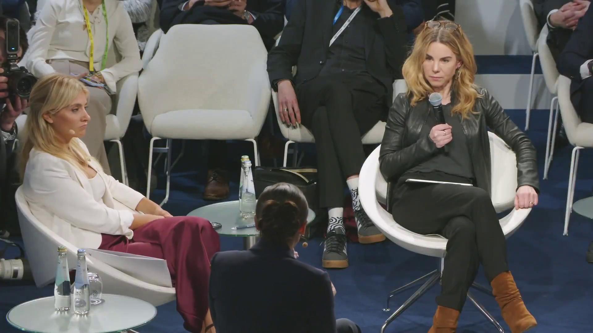 a woman in a suit sitting on a chair aoc alexandria ocasio cortez film still from dune 2020 alexandria ocasio cortez imet2020 alexandria ocasiocortez sharp and coherent extremely clear and coherent beautiful coherent professional as a panel of a marvel comic deepfake power pose